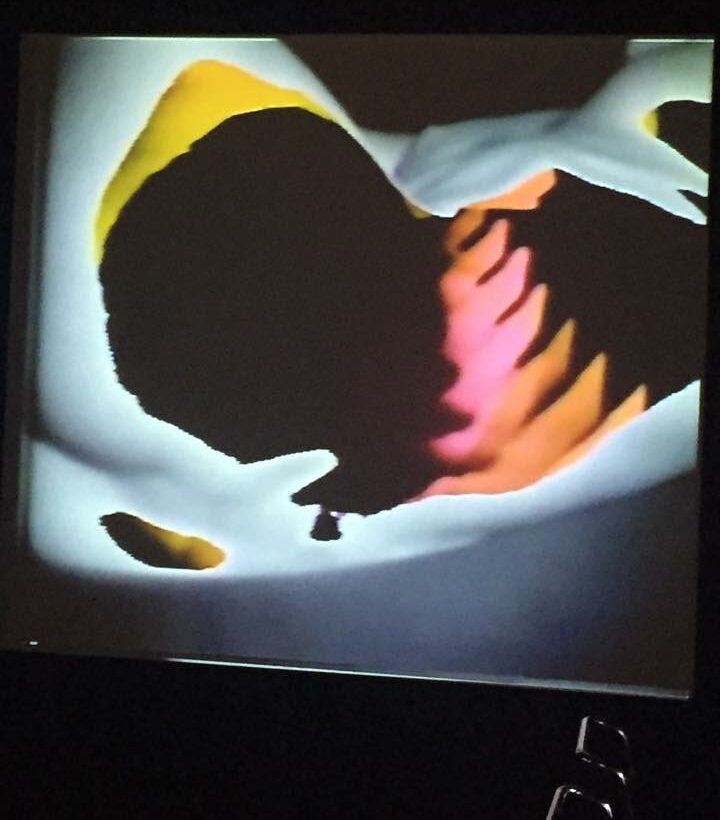 Ralph Hocking's Transparent Body #3 on a screen: abstract black, white, yellow and pink shapes